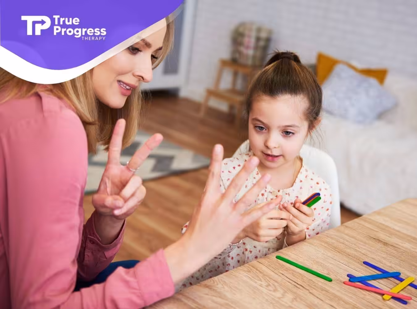 ABA therapist teaching autistic girl to count.
