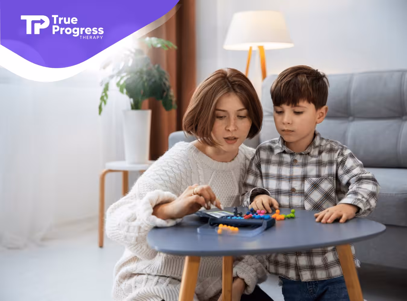 A child and an RBT during ABA therapy