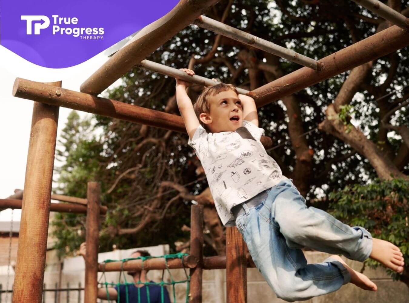 A child with autism hanging from monkey bars on a playground in NJ.
