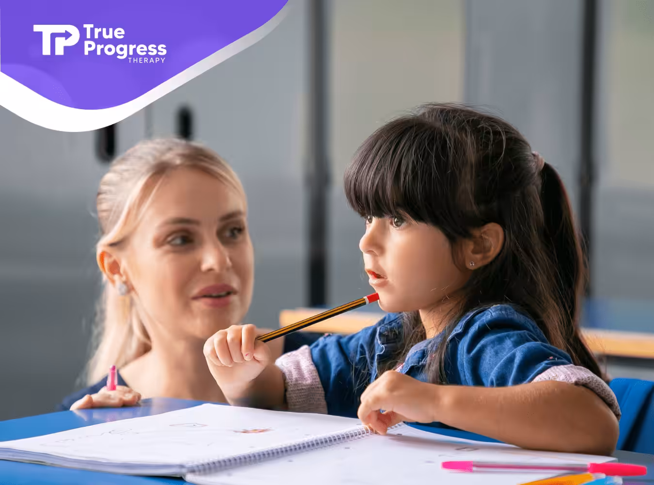 An ABA therapist attentively observes a young girl.
