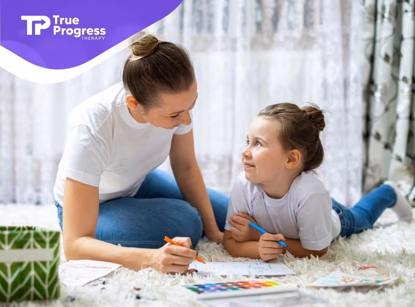 Female ABA therapist and autistic girl doing art during ABA therapy.