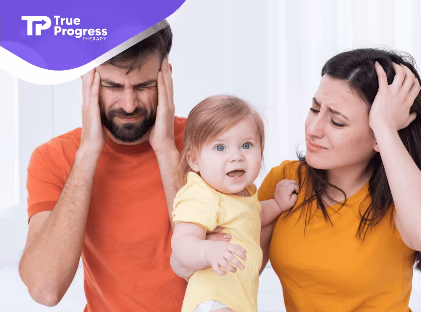 Parent with a baby looking stressed