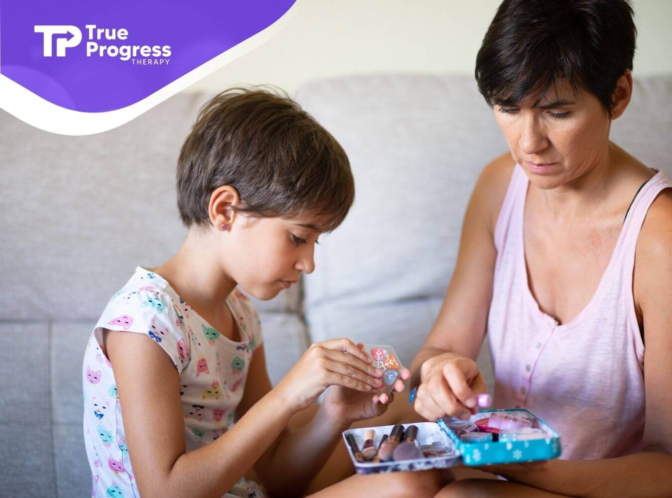 A therapist and an autistic kid sitting together as they explore creative play, supporting bonding and emotional connection