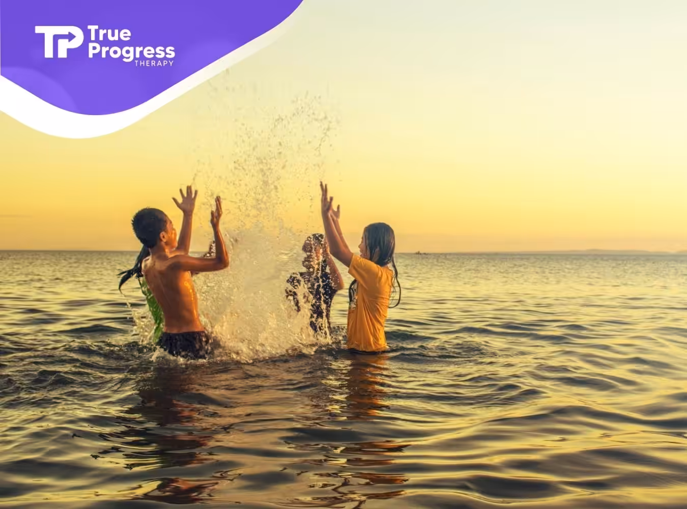 Autistic children carefully playing and splashing in the sea during golden hour in New Jersey.