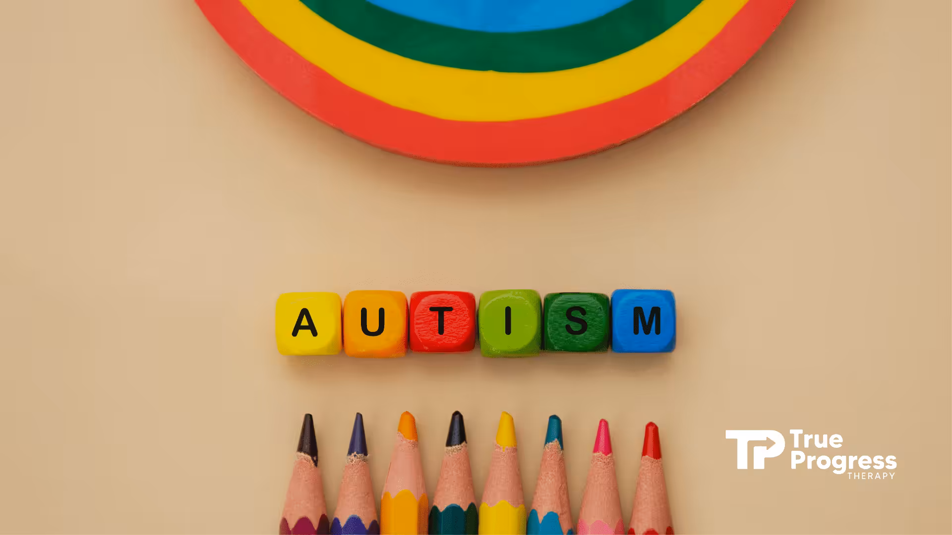 The word "autism" spelled in colorful blocks