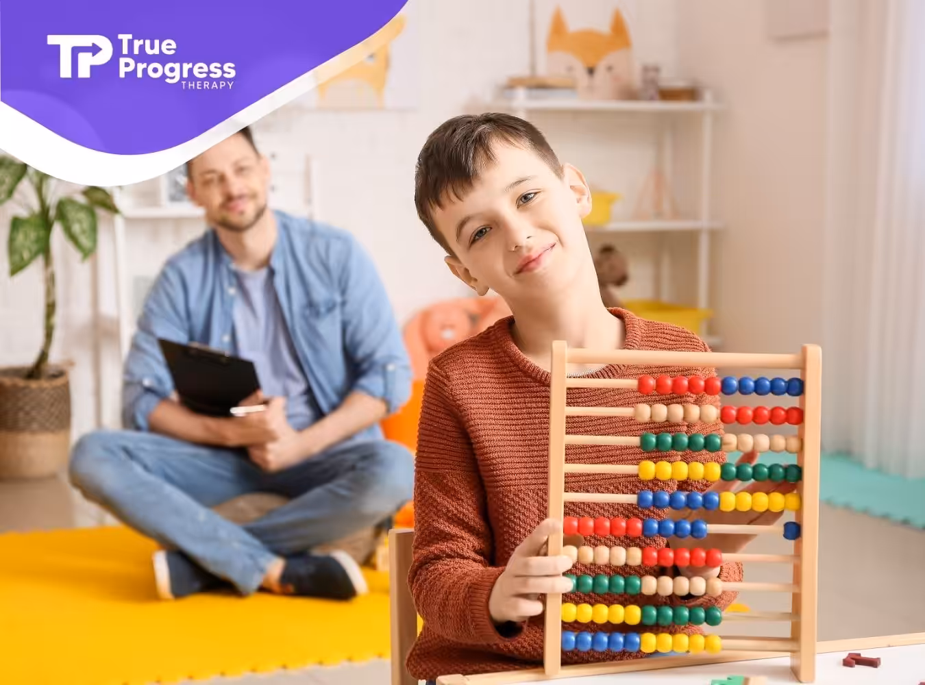 A child with abacus, and his ABA therapist behind him.