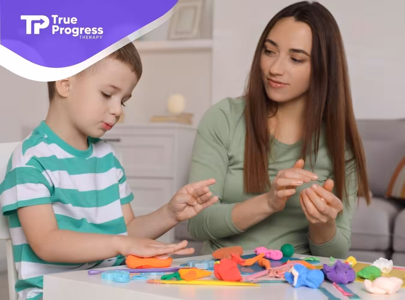 BCBA and autistic boy playing with colorful clay during ABA therapy.