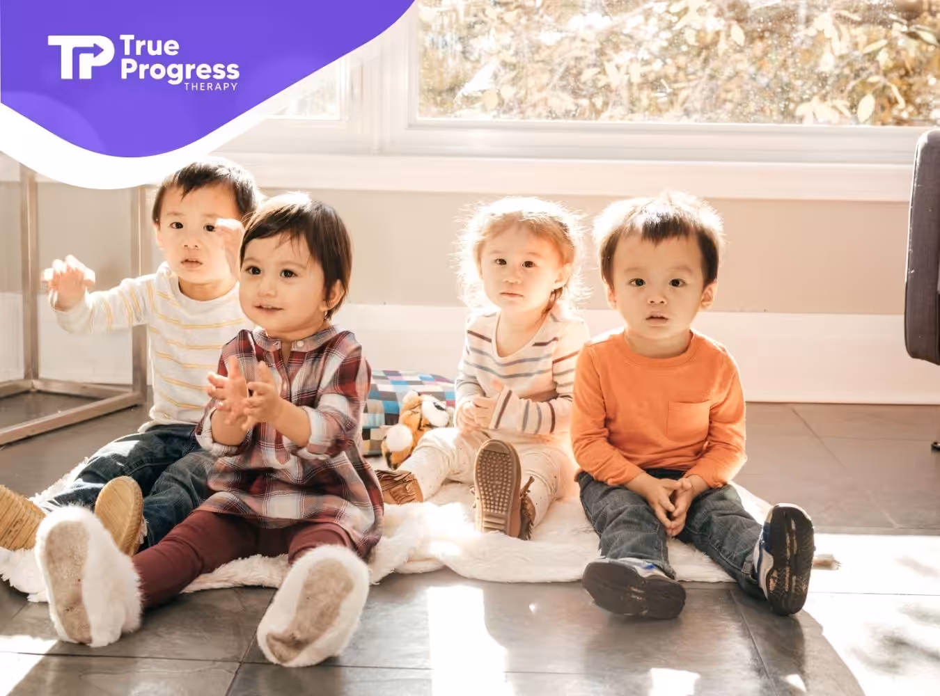 a group of children sitting on the floor