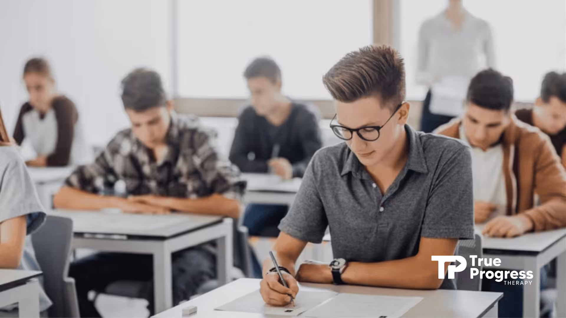 RBT students sitting at desks focused on taking a RBT exam at a testing center in New Jersey.