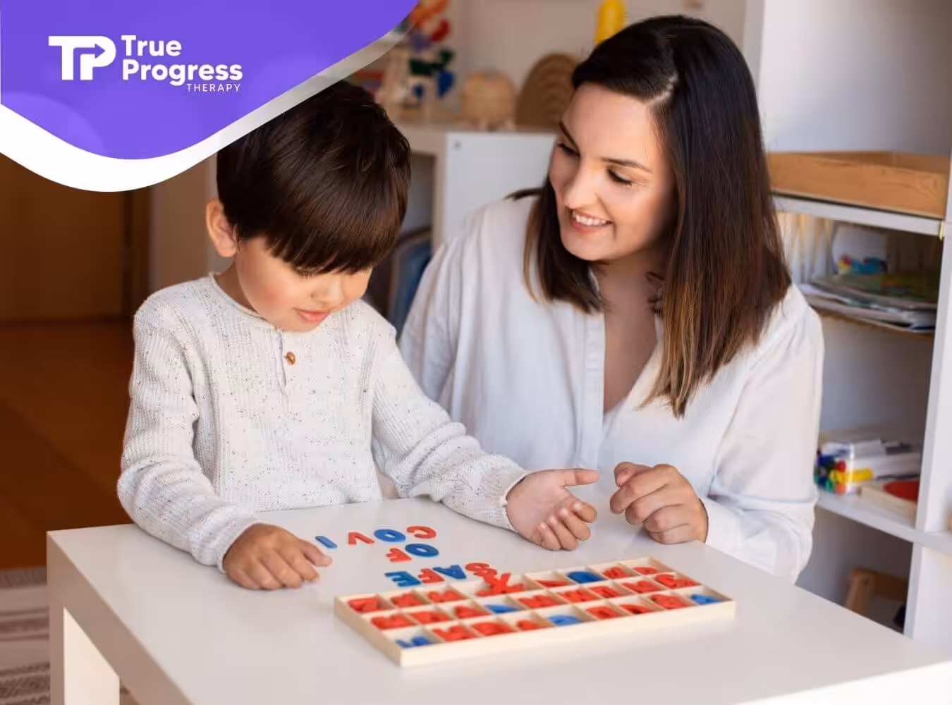 ABA therapist looking at autistic boy during ABA therapy session