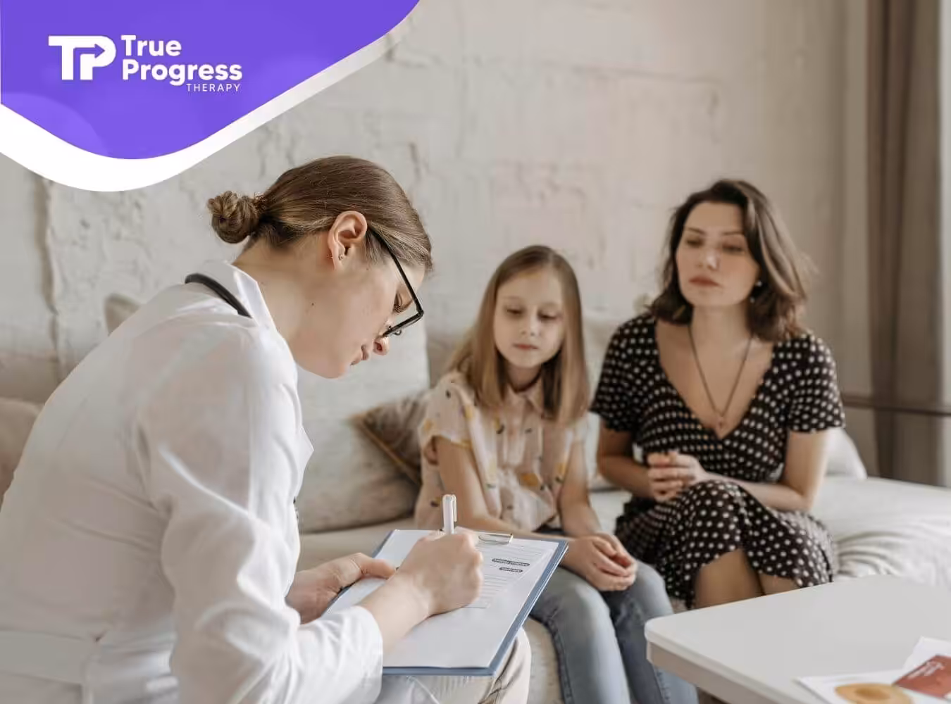 The ABA therapist writing notes while a mother and her autistic child wait in a doctor's office in New Jersey.