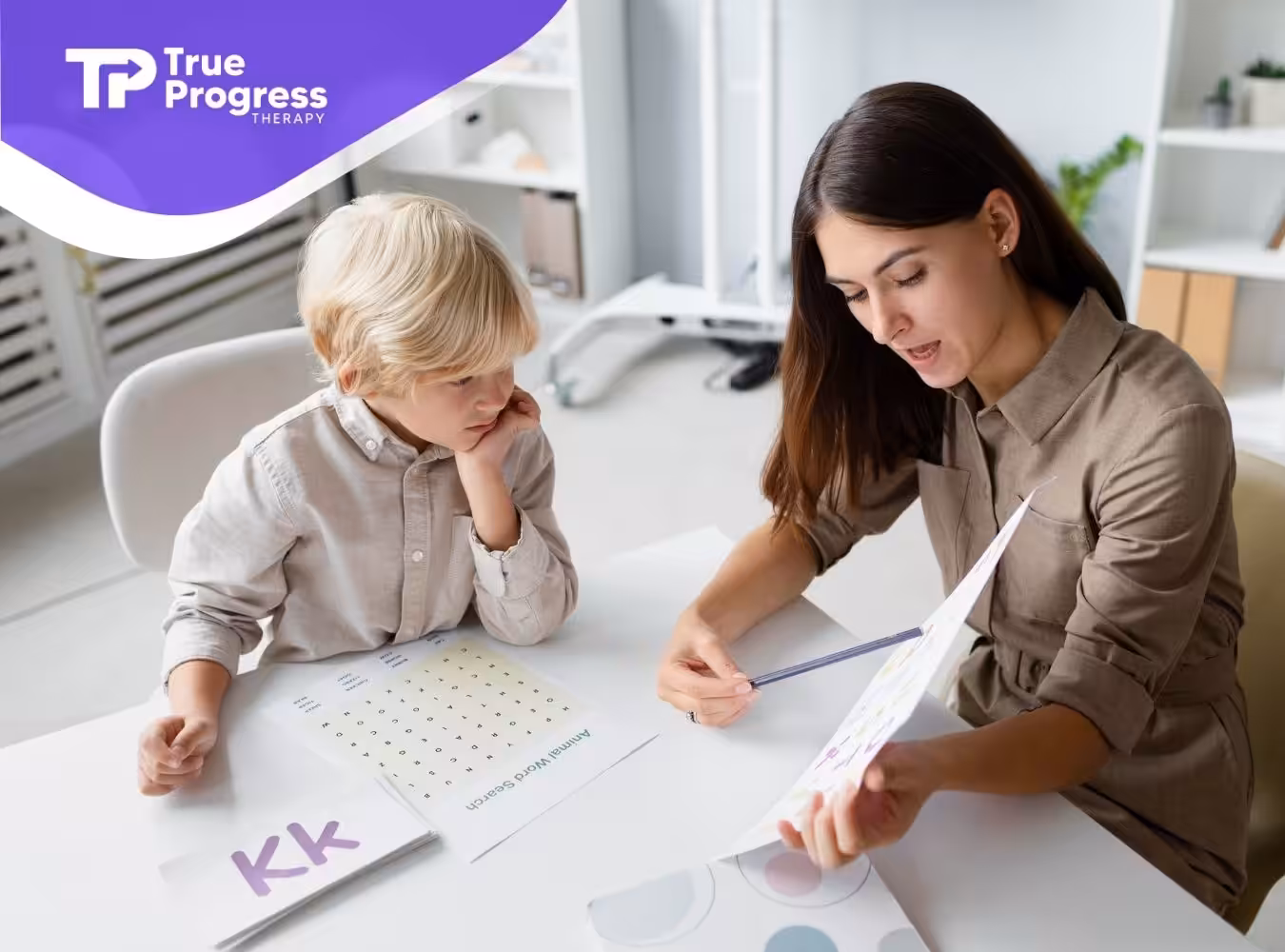 A psychologist explains a worksheet to a thoughtful boy.
