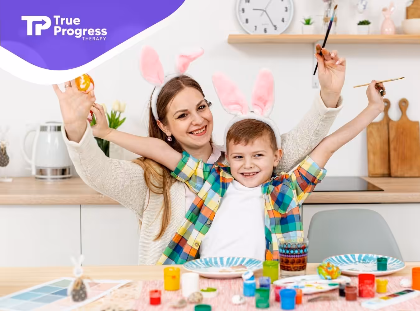 An ABA therapist and a child wearing bunny ears enjoy a creative painting activity together.