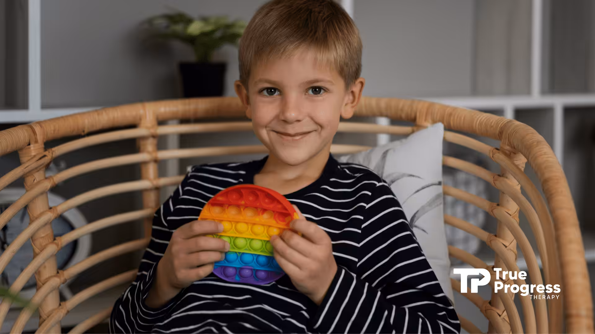 An autistic child holding a fidget toy