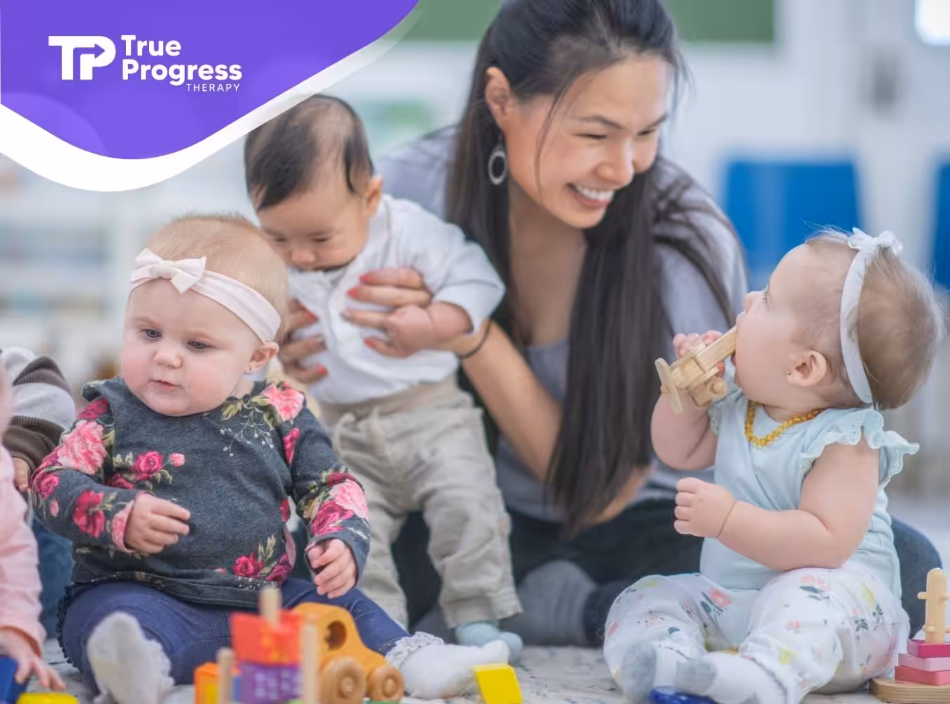 a woman with babies and toys