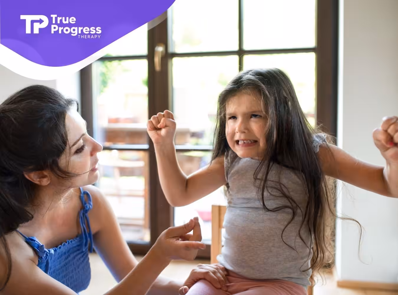 A little girl having a tantrum to her mother.