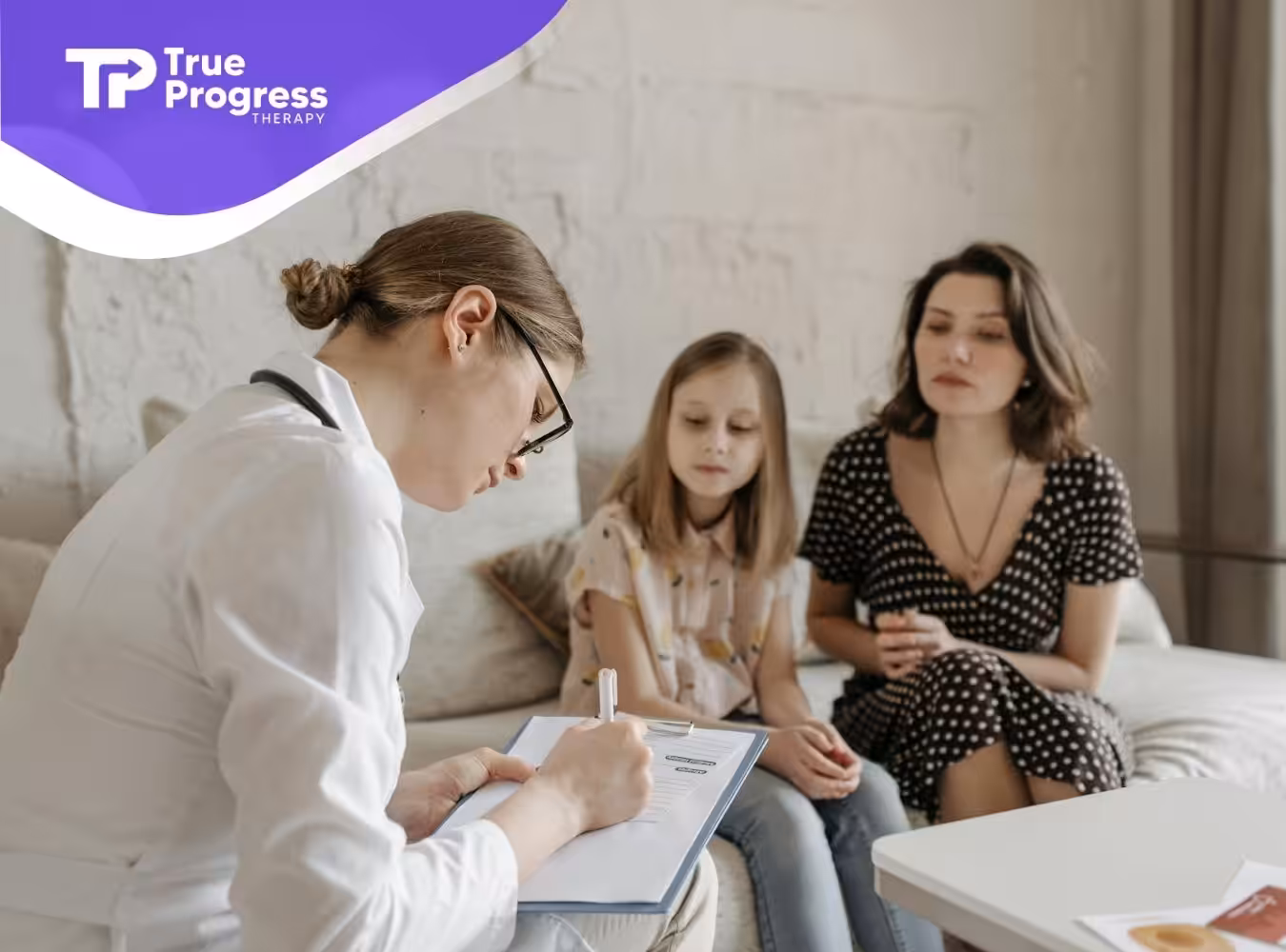 ABA therapist performs whole interval recording while a mother and autistic daughter sit on couch.