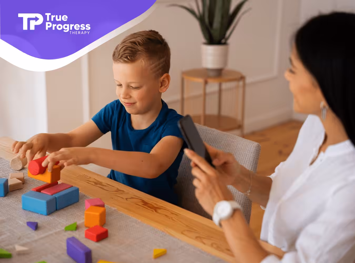 An ABA therapist and a child with autism during their ABA therapy session