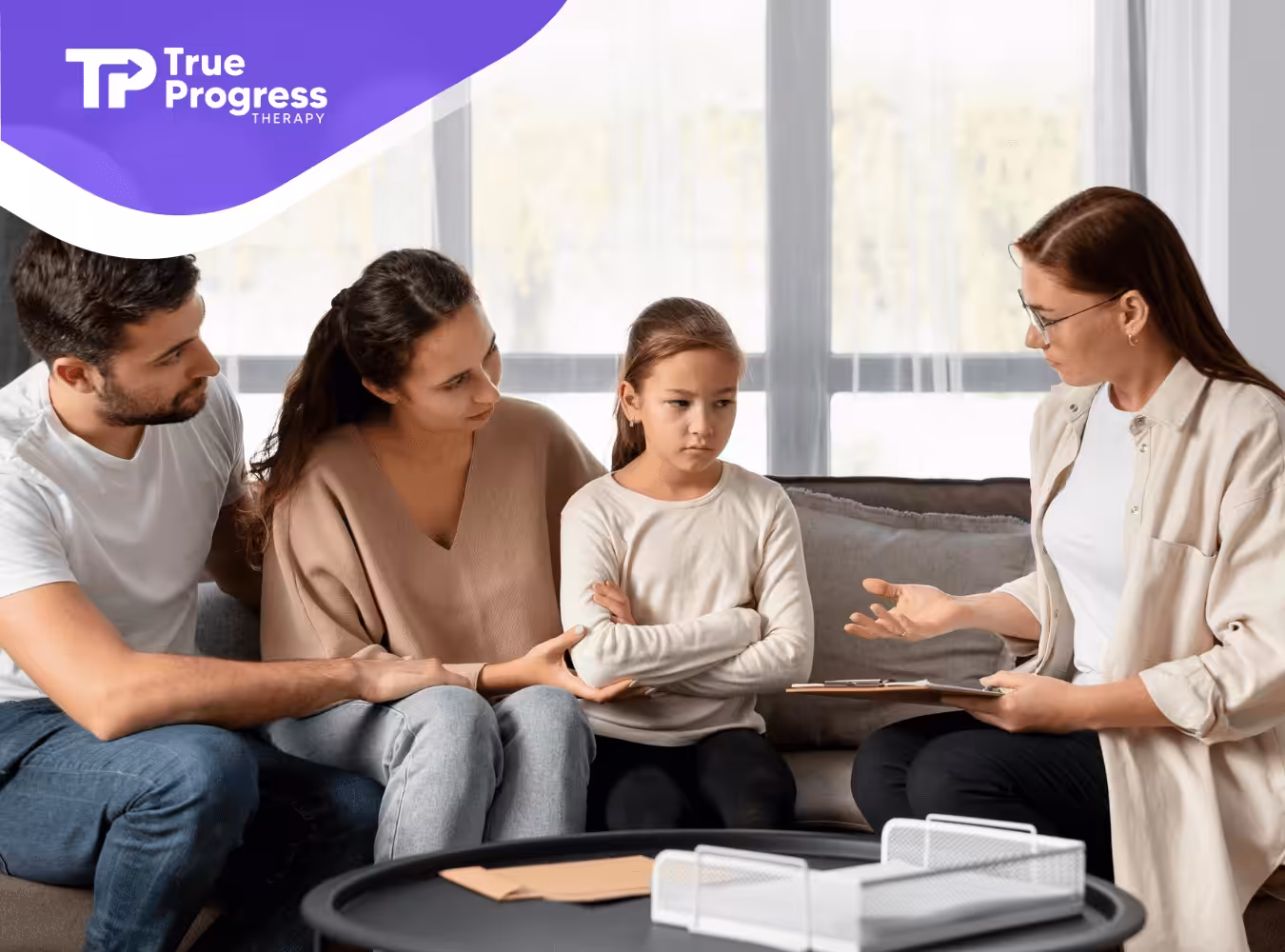 An ABA therapist talking to a family during autism family counseling.