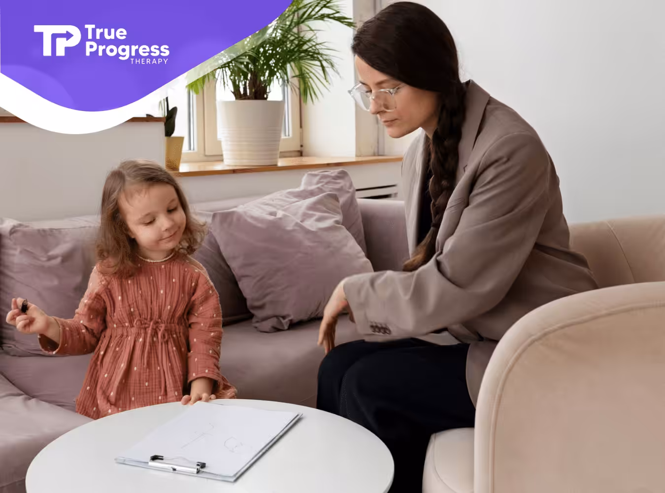 A BCBA talking to a little girl with autism
