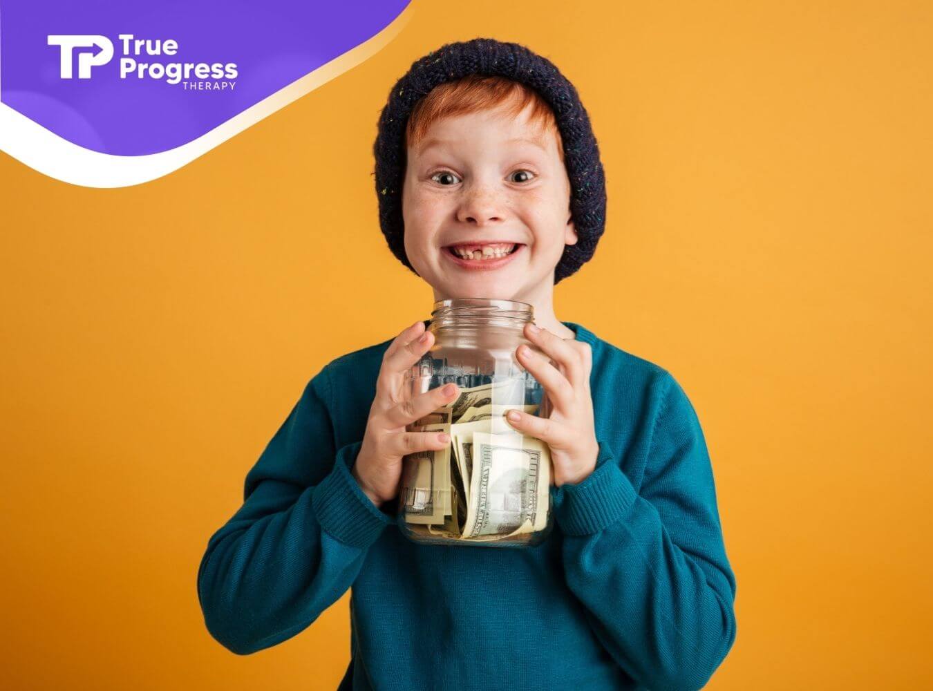 A smiling child holds a jar of cash.