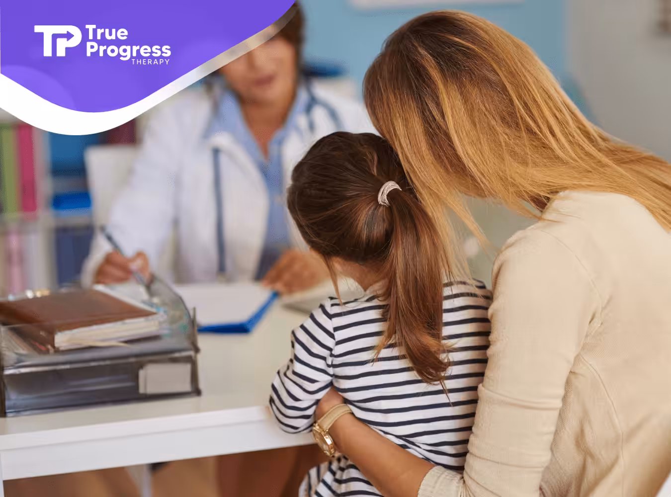 A mom and her daughter with autism talking to a doctor