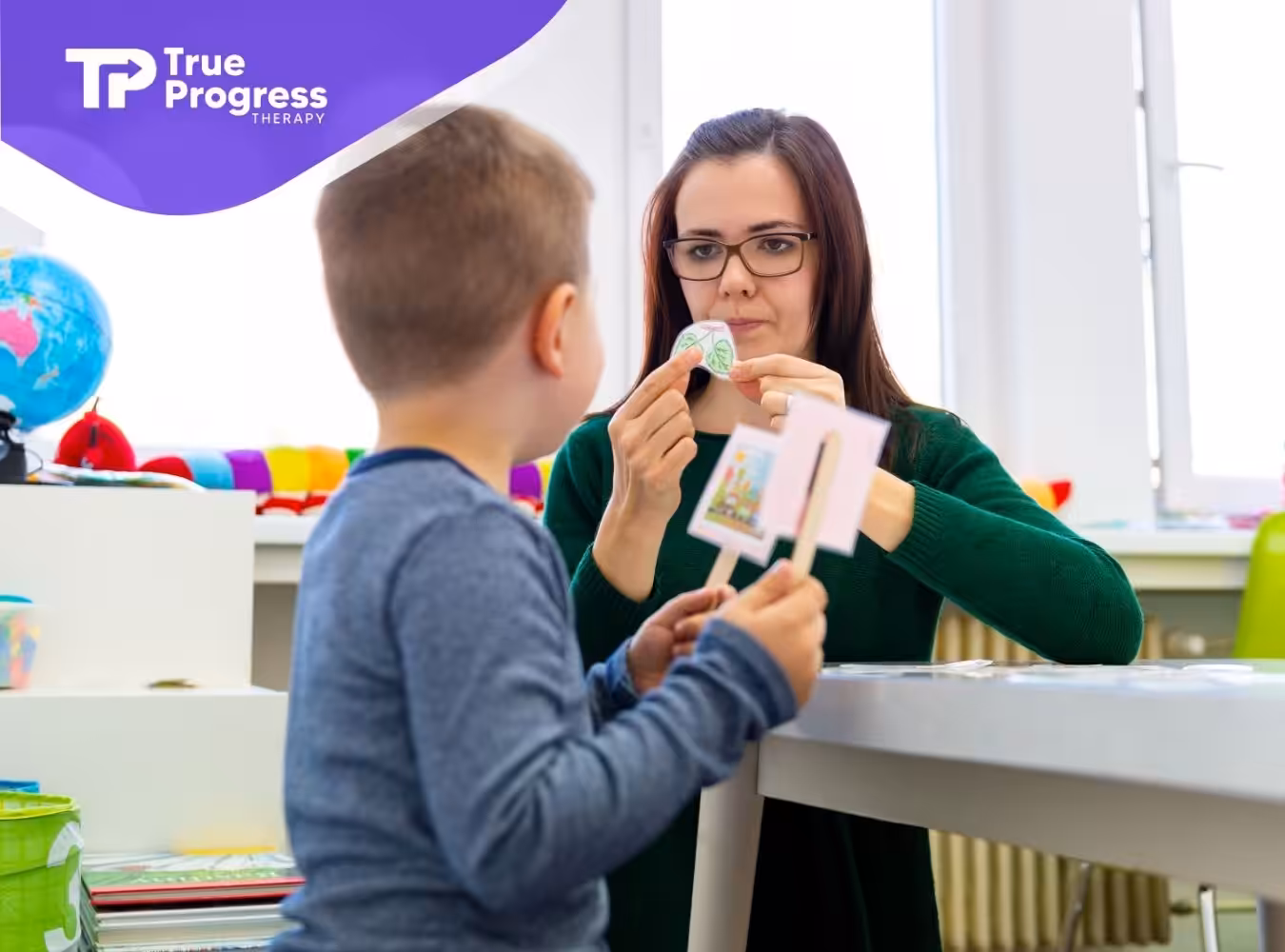 a little boy learning with his aba therapist
