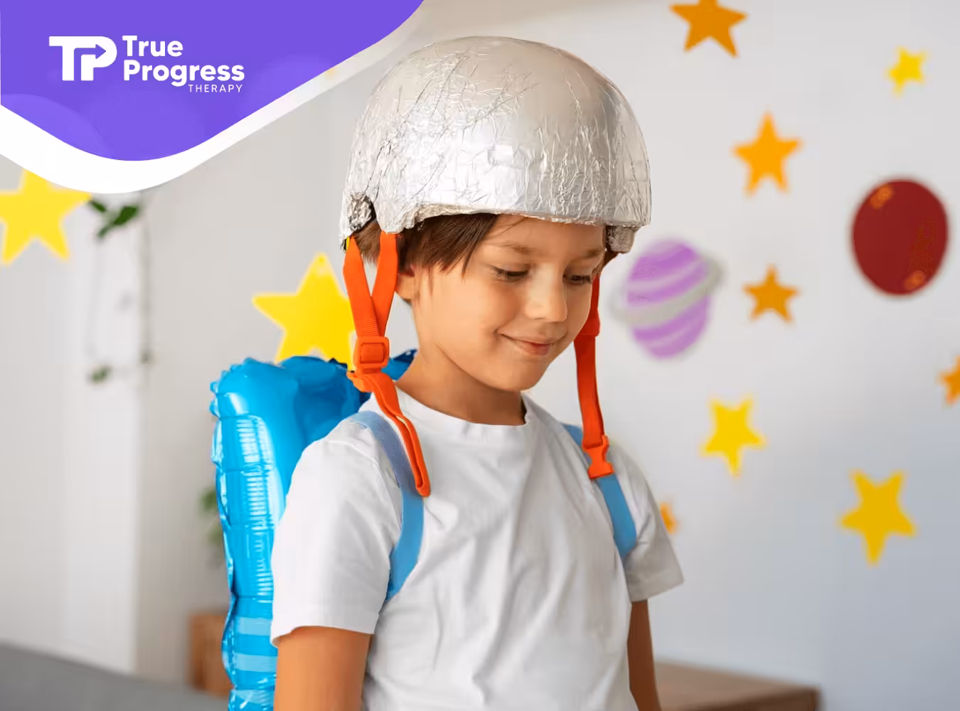 An autistic child wearing a toy helmet