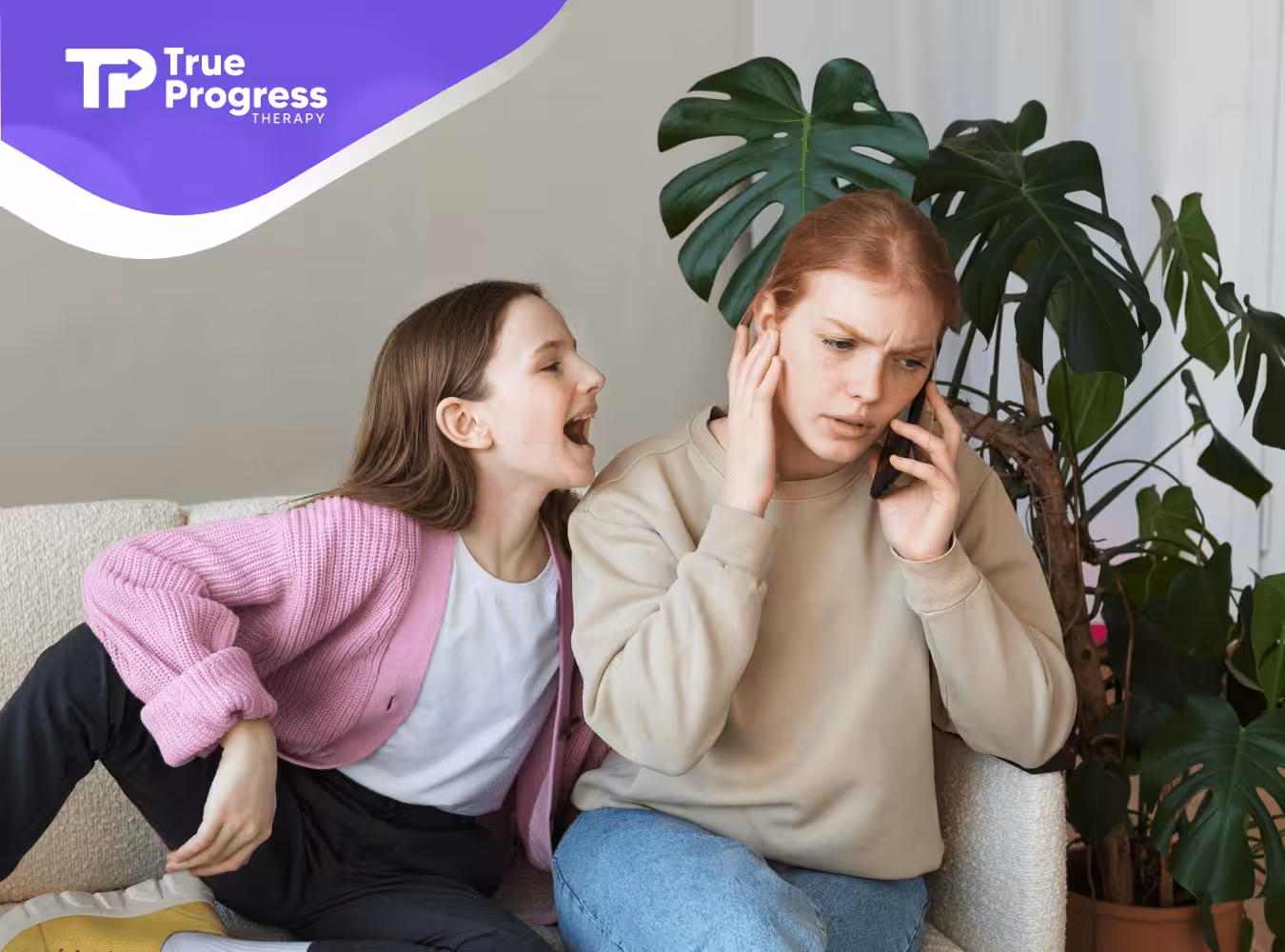 A child is shouting at her mom while she's on the phone