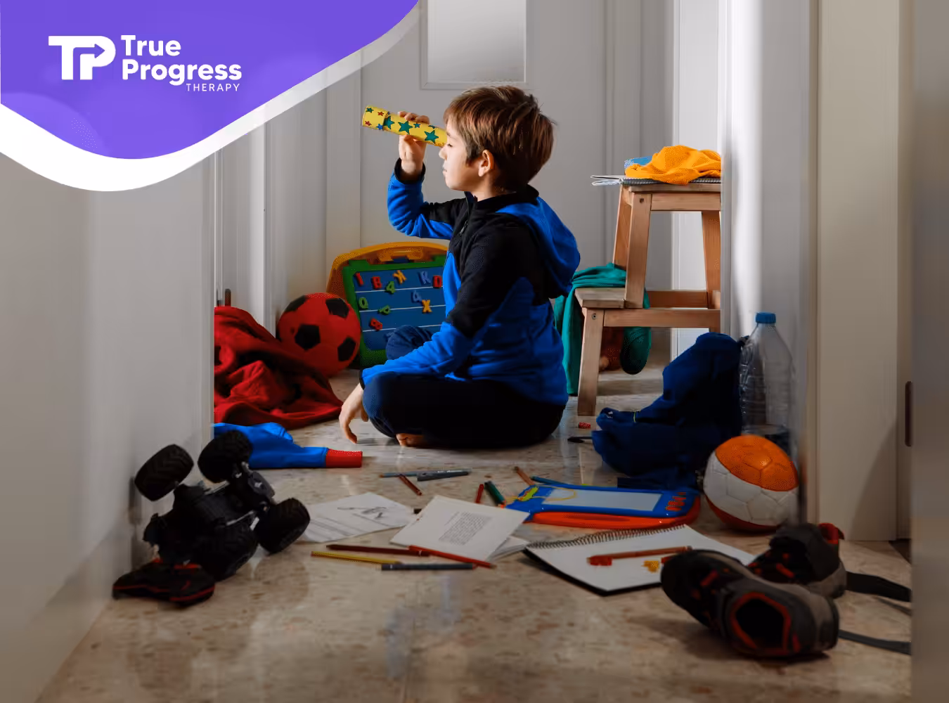 A kid with autism is busy playing alone