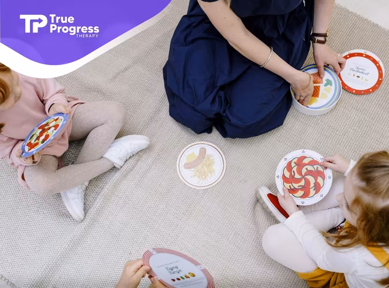 Autistic children learning with an ABA therapist using picture cards during ABA therapy session in New Jersey.