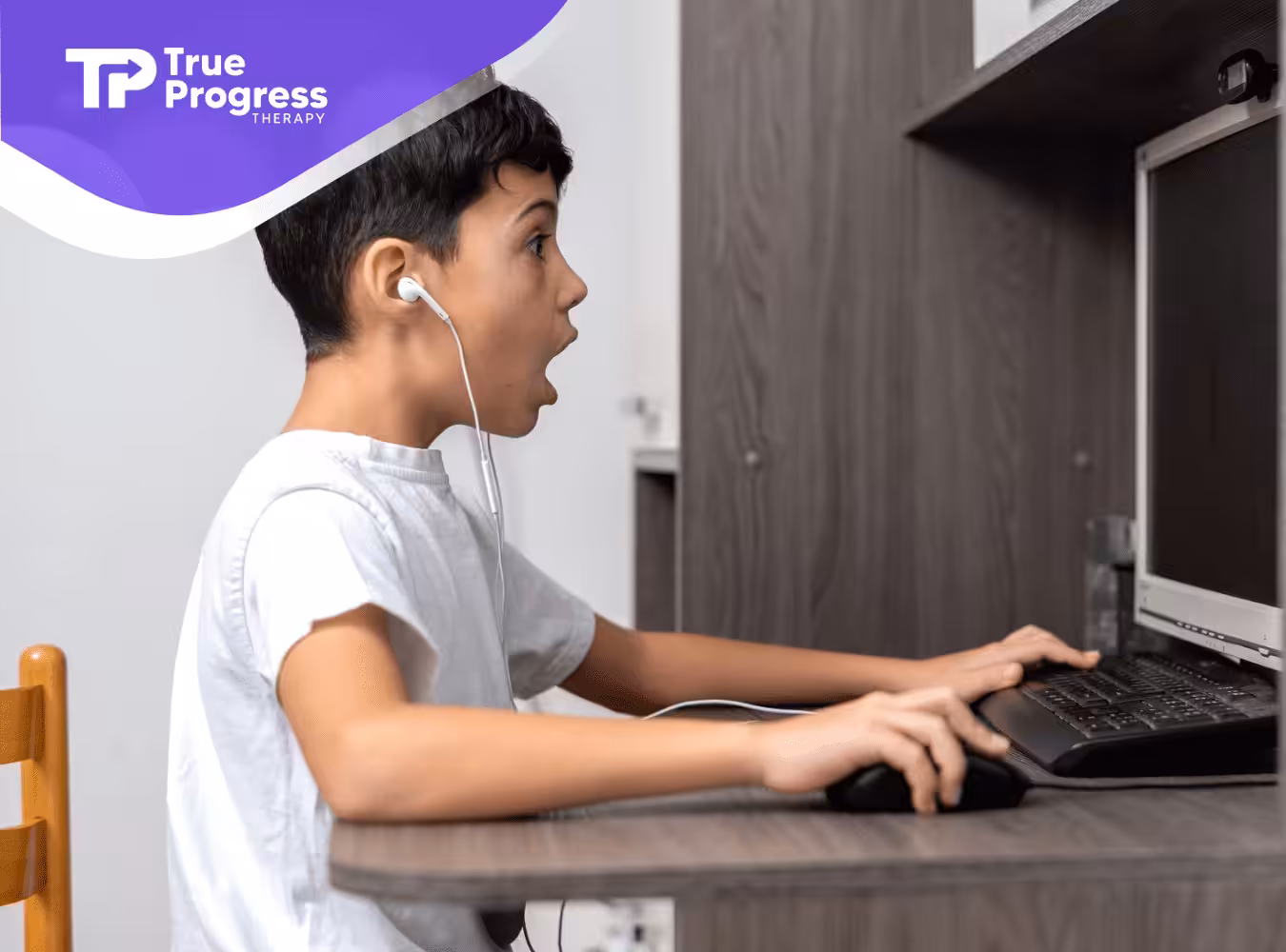 A boy with autism is playing Minecraft on a computer