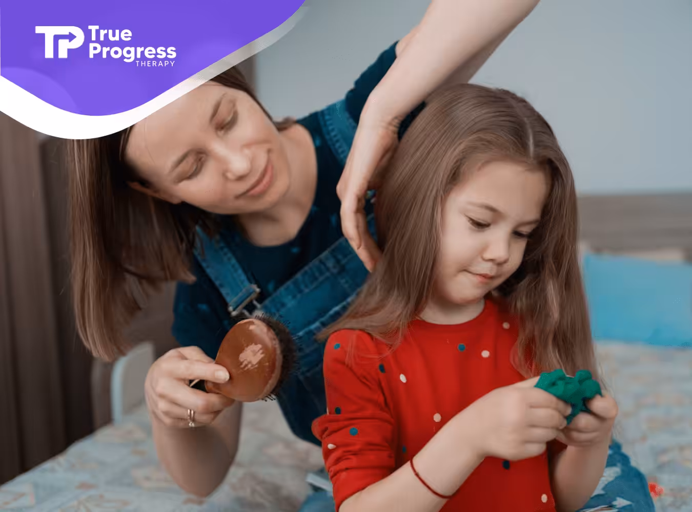 A mother combing her daughter's hair