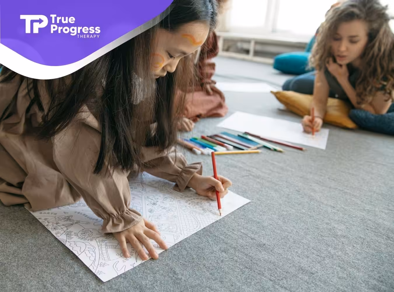 An autistic girl coloring a detailed drawing on the floor, surrounded by colored pencils in NJ.