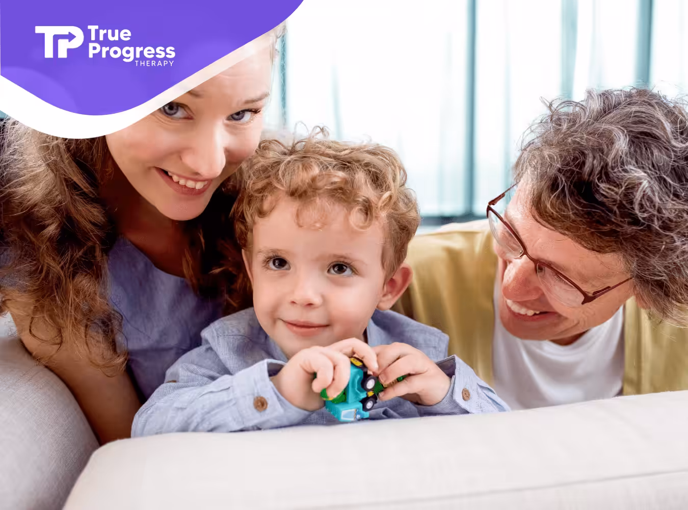 A kid with autism and his parents during ABA therapy