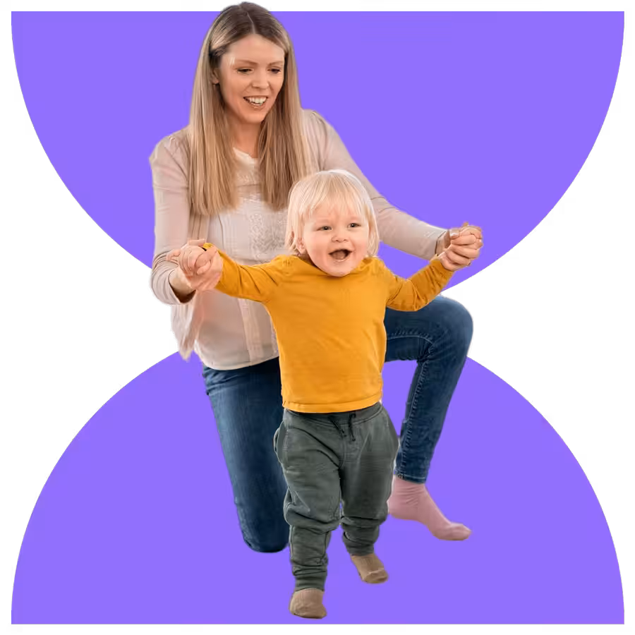 A True Progress Therapy therapist smiling with a toddler during an in-home ABA session