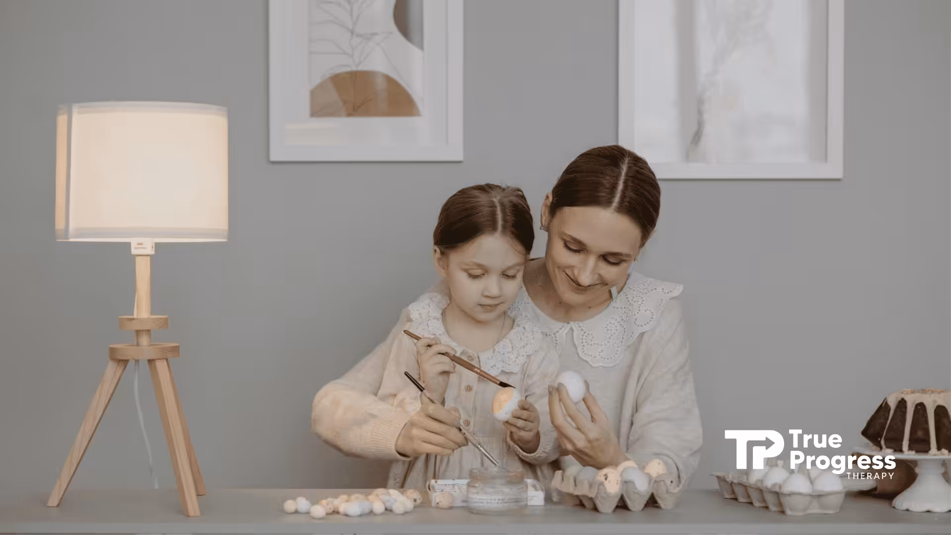 An ABA therapist and autistic kid decorating Easter eggs together at a cozy room in New Jersey.