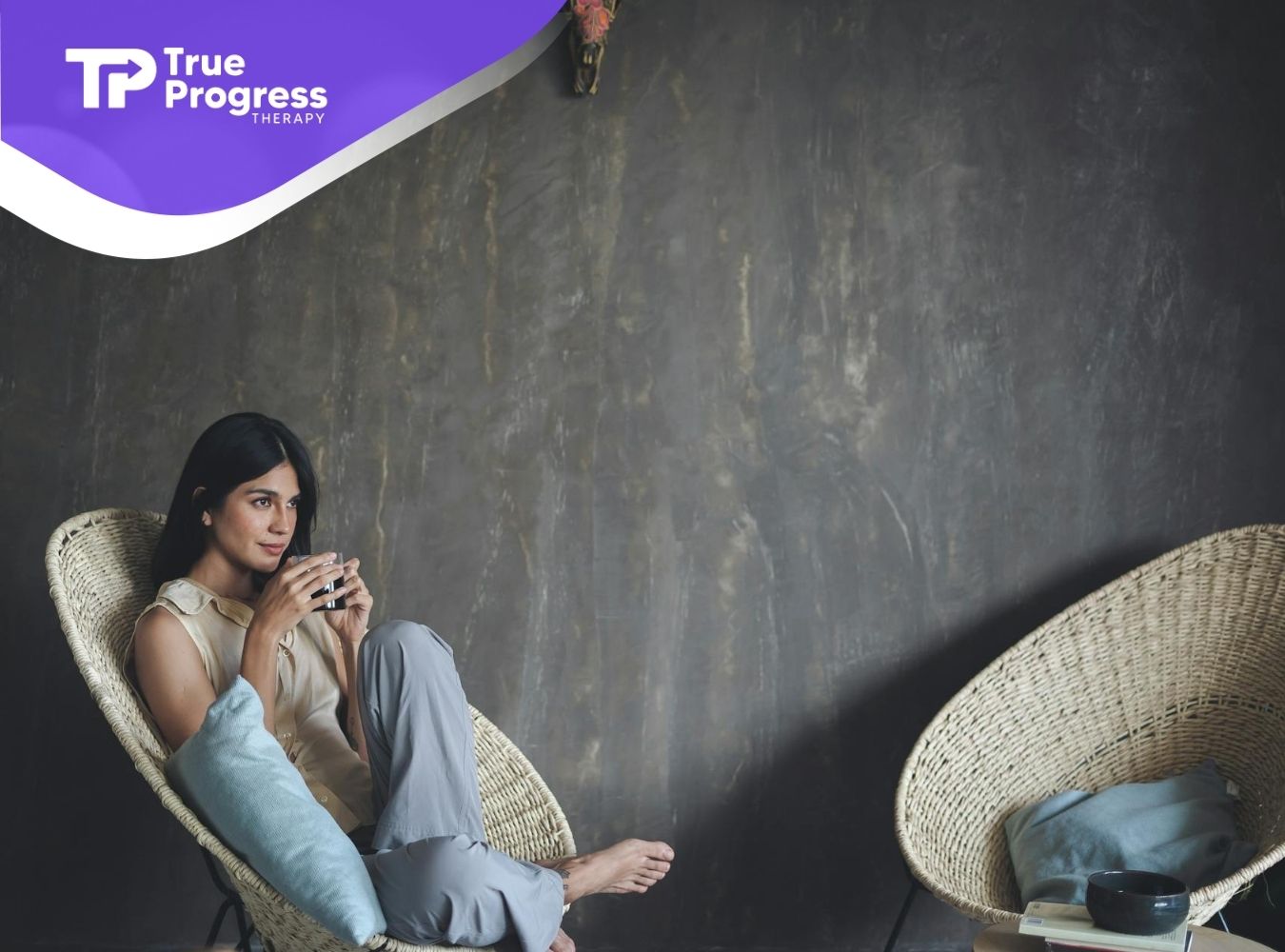 An autistic woman relaxing in a wicker chair with a cup of coffee after an ABA therapy session in New Jersey.
